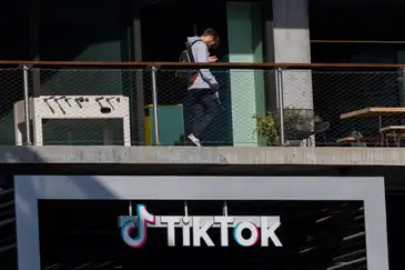 REUTERS/Mike Blake A person arrives at the offices of Tik Tok after the U.S. House of Representatives overwhelmingly passed a bill that would give TikTok's Chinese owner ByteDance about six months to divest the U.S. assets of the short-video app or face a ban, in Culver City, California, U.S., March 13, 2024. REUTERS/Mike Blake