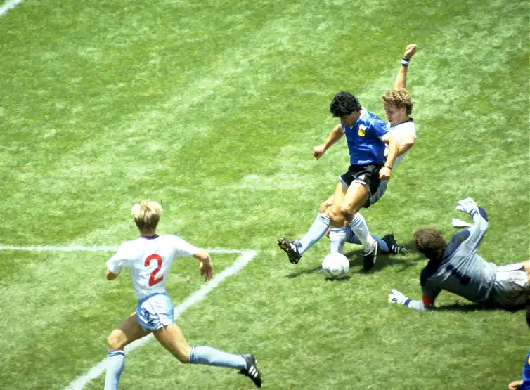 FILE PHOTO: Football - 1986 FIFA World Cup - Quarter Final - England v  Argentina - Azteca Stadium, Mexico City - 22/6/86   Diego Maradona scores for Argentina.  Mandatory Credit: Action Images / Juha Tamminen/File Photo